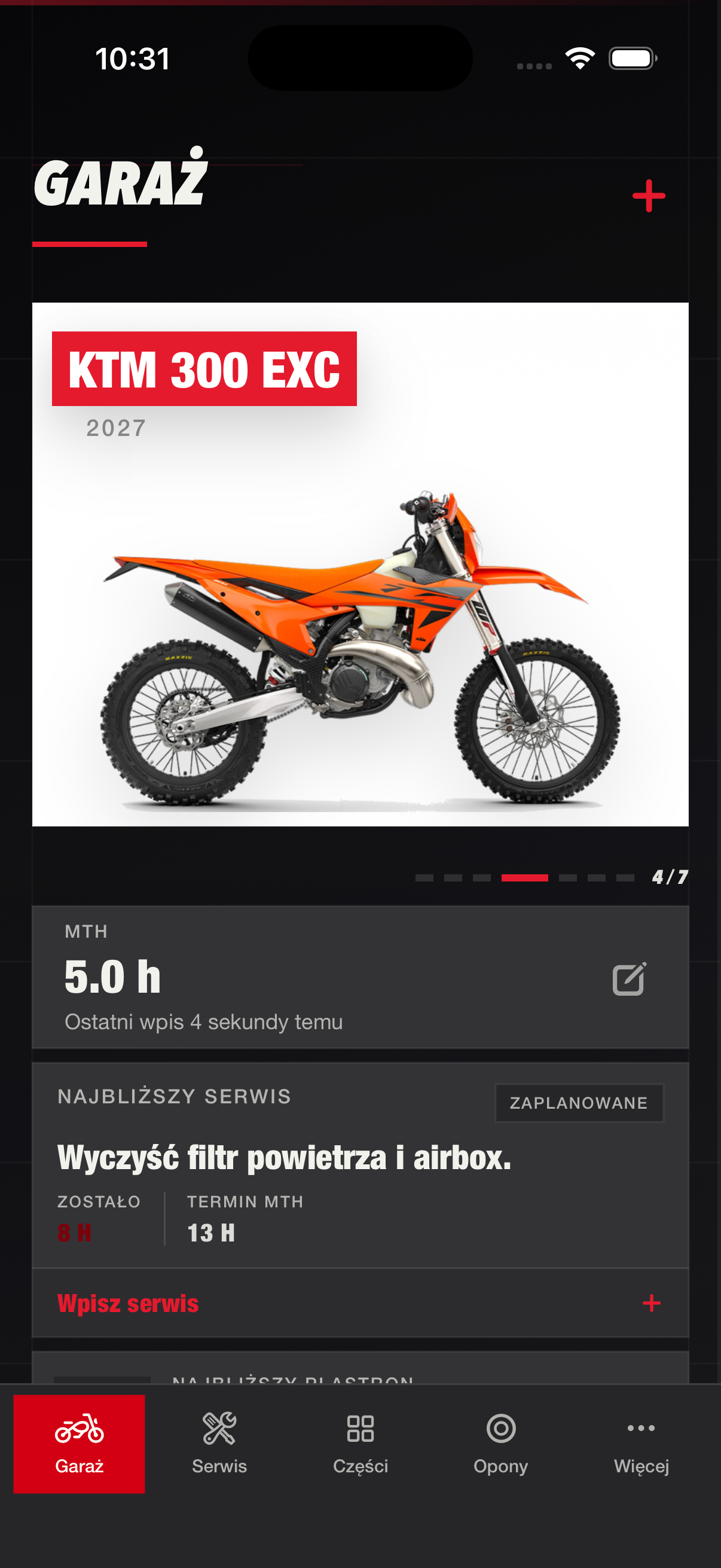 Ekran Garage w aplikacji RUTT z motocyklem, motogodzinami i panelami serwisu